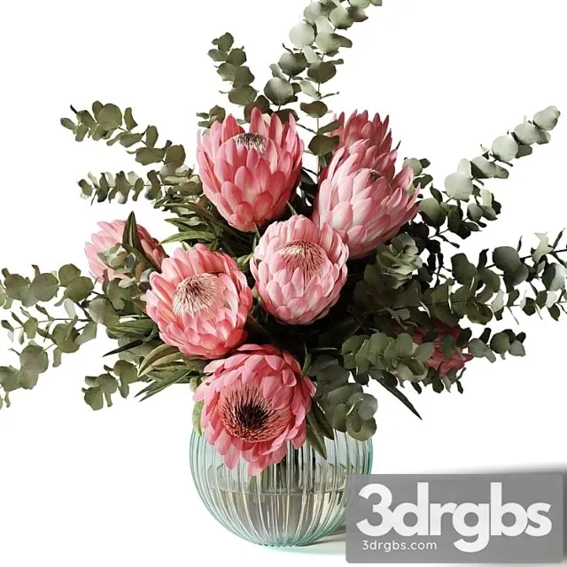 Bouquet with pink proteas and eucalyptus in a ribbed glass vase